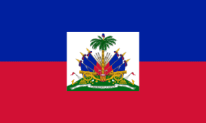 Flag of Haiti: blue and red horizontal bands with a white centered shield showing a palm tree, cannons, and flags with a motto ribbon.